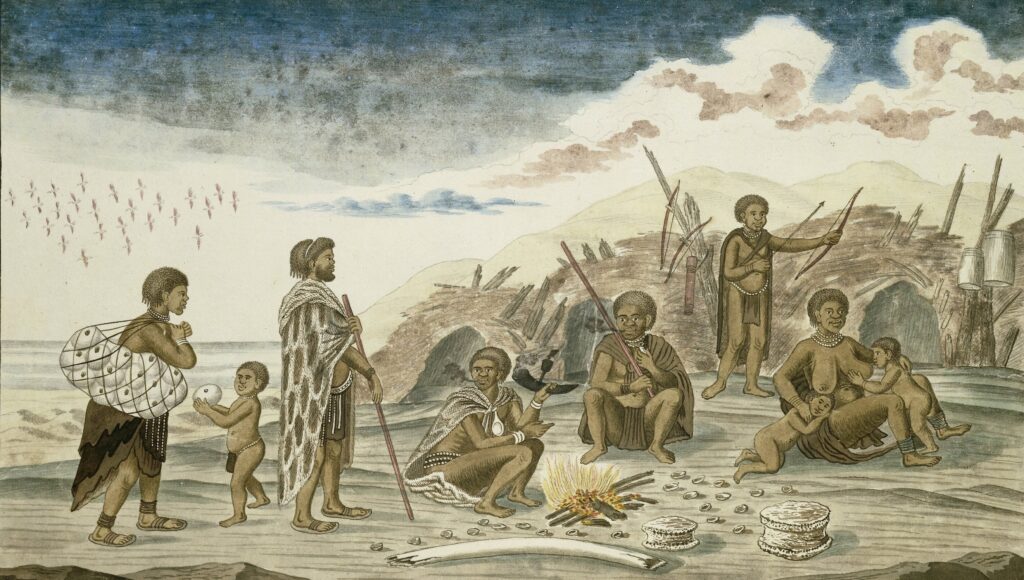 San voor hun hutten op het strand