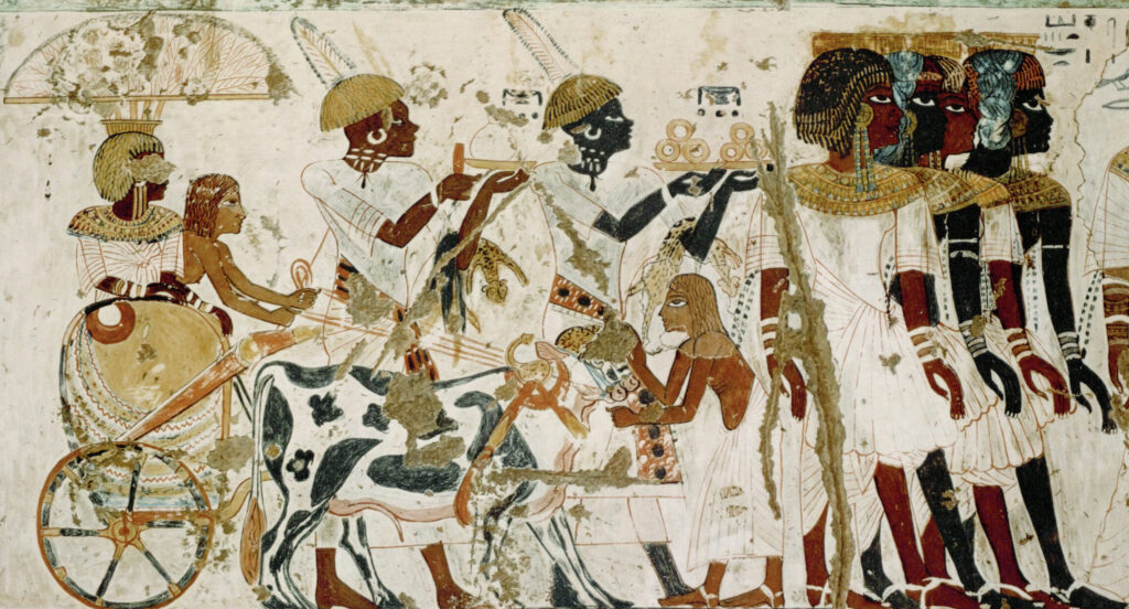 Nubiërs dragen geschenken voor farao Toetanchamon